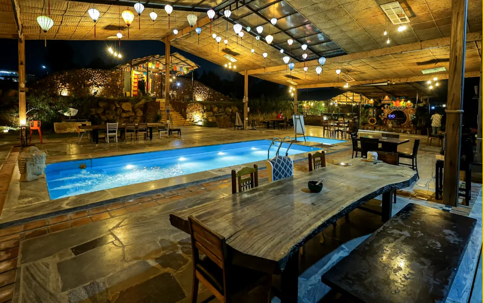 The poolside dining area at Buddha Village Resort