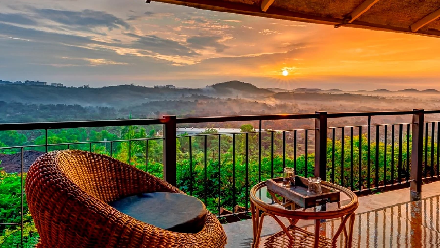 Sunrise over the valley from a balcony at Estate Resort